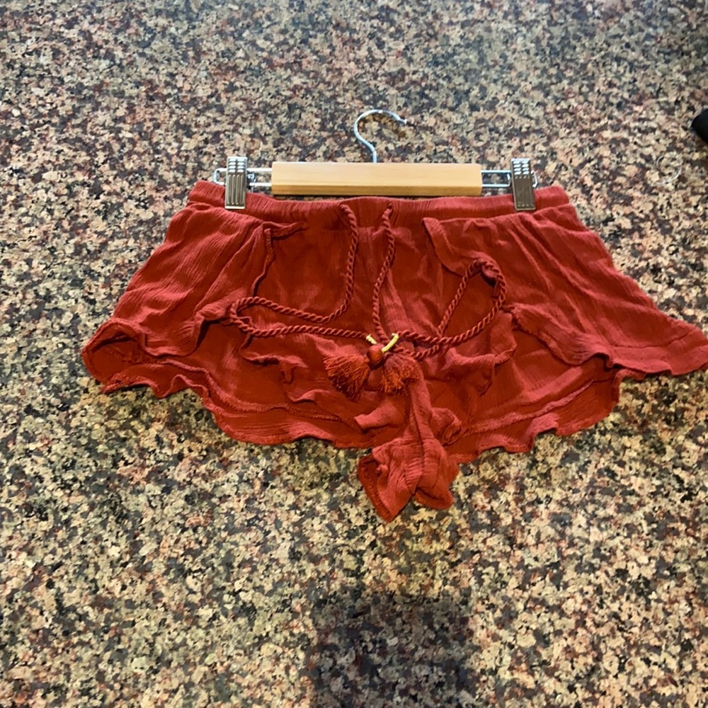 Rust colored beach cover up shorts with tassels